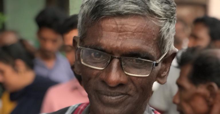 A smiling elderly beneficiary of Merci Lanka