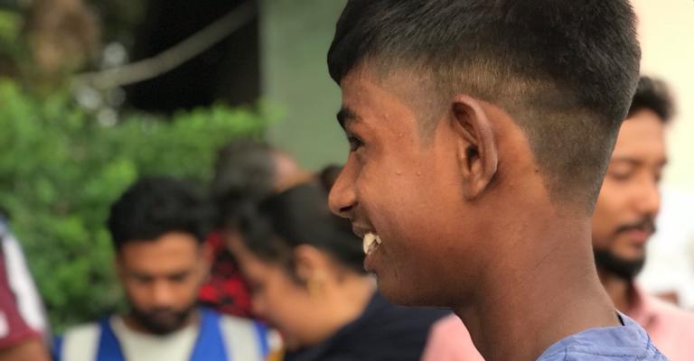 A young beneficiary smiling